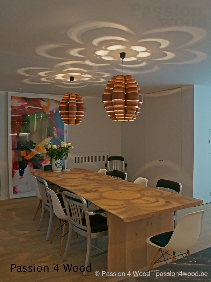 Glow lamp in walnut hout above table in oak